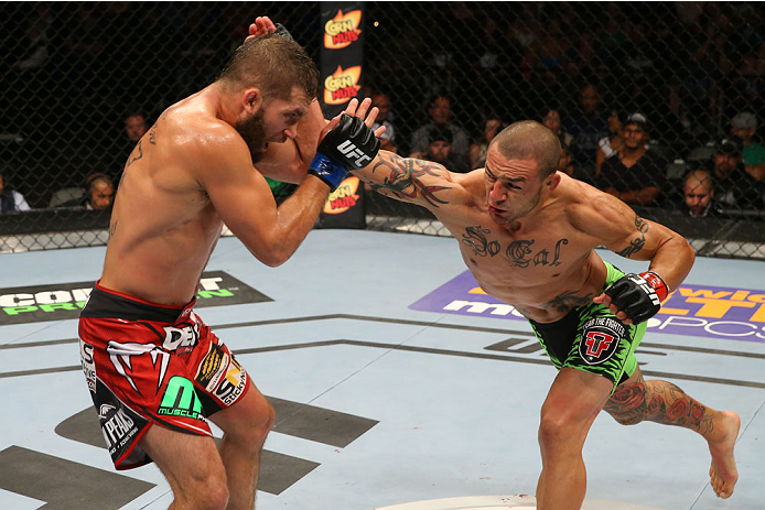 SAN ANTONIO, TX - JUNE 28: (R-L) Cub Swanson punches Jeremy Stephens in their featherweight bout at the AT&T Center on June 28, 2014 in San Antonio, Texas. (Photo by Ed Mulholland/Zuffa LLC/Zuffa LLC via Getty Images)