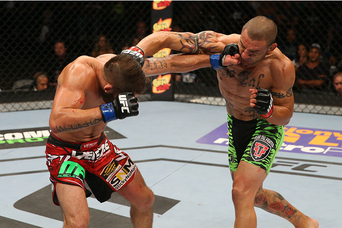 SAN ANTONIO, TX - JUNE 28: (L-R) Jeremy Stephens and Cub Swanson exchange punches in their featherweight bout at the AT&T Center on June 28, 2014 in San Antonio, Texas. (Photo by Ed Mulholland/Zuffa LLC/Zuffa LLC via Getty Images)