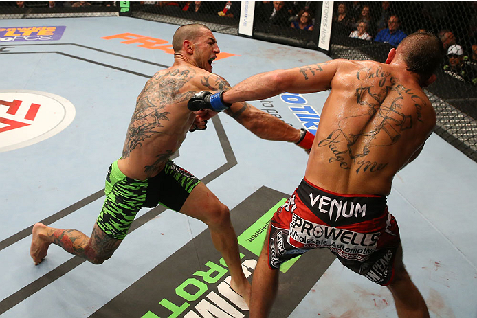 SAN ANTONIO, TX - JUNE 28: (L-R) Cub Swanson punches Jeremy Stephens in their featherweight bout at the AT&T Center on June 28, 2014 in San Antonio, Texas. (Photo by Ed Mulholland/Zuffa LLC/Zuffa LLC via Getty Images)