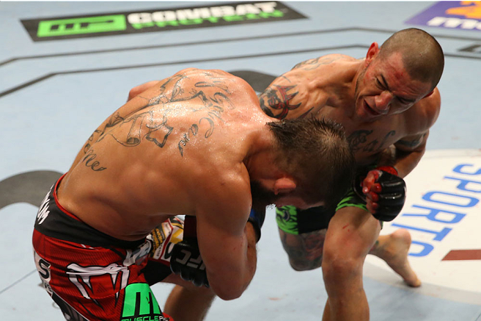 SAN ANTONIO, TX - JUNE 28: (R-L) Cub Swanson punches Jeremy Stephens in their featherweight bout at the AT&T Center on June 28, 2014 in San Antonio, Texas. (Photo by Ed Mulholland/Zuffa LLC/Zuffa LLC via Getty Images)