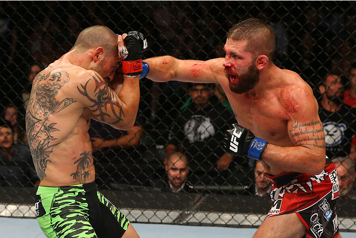 SAN ANTONIO, TX - JUNE 28: (R-L) Jeremy Stephens punches Cub Swanson in their featherweight bout at the AT&T Center on June 28, 2014 in San Antonio, Texas. (Photo by Ed Mulholland/Zuffa LLC/Zuffa LLC via Getty Images)