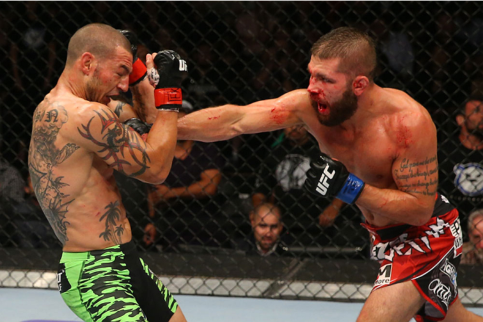 SAN ANTONIO, TX - JUNE 28: (R-L) Jeremy Stephens punches Cub Swanson in their featherweight bout at the AT&T Center on June 28, 2014 in San Antonio, Texas. (Photo by Ed Mulholland/Zuffa LLC/Zuffa LLC via Getty Images)