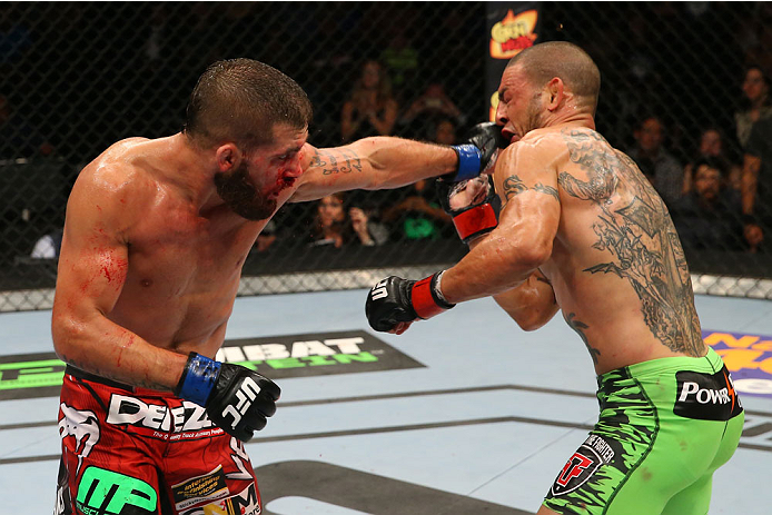 SAN ANTONIO, TX - JUNE 28: (L-R) Jeremy Stephens punches Cub Swanson in their featherweight bout at the AT&T Center on June 28, 2014 in San Antonio, Texas. (Photo by Ed Mulholland/Zuffa LLC/Zuffa LLC via Getty Images)