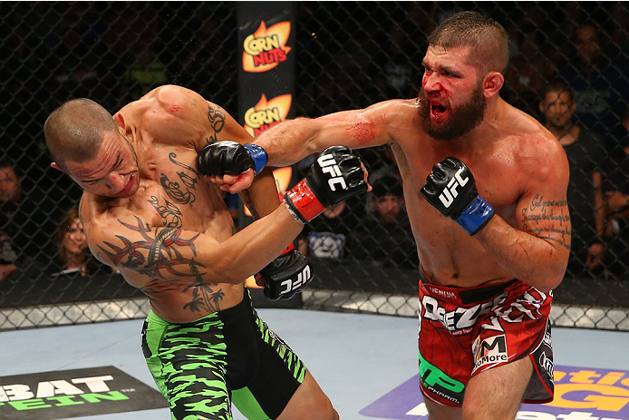 SAN ANTONIO, TX - JUNE 28: (R-L) Jeremy Stephens punches Cub Swanson in their featherweight bout at the AT&T Center on June 28, 2014 in San Antonio, Texas. (Photo by Ed Mulholland/Zuffa LLC/Zuffa LLC via Getty Images)