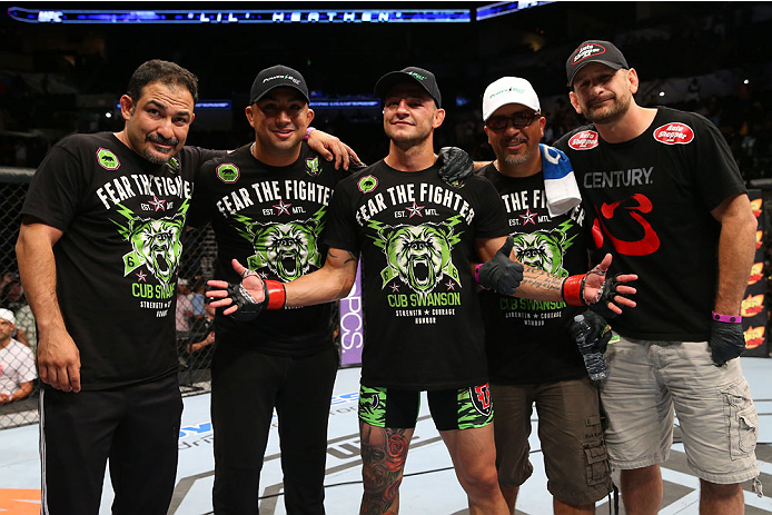 SAN ANTONIO, TX - JUNE 28: Cub Swanson (center) poses with his teammates after his featherweight bout at the AT&T Center on June 28, 2014 in San Antonio, Texas. (Photo by Ed Mulholland/Zuffa LLC/Zuffa LLC via Getty Images)