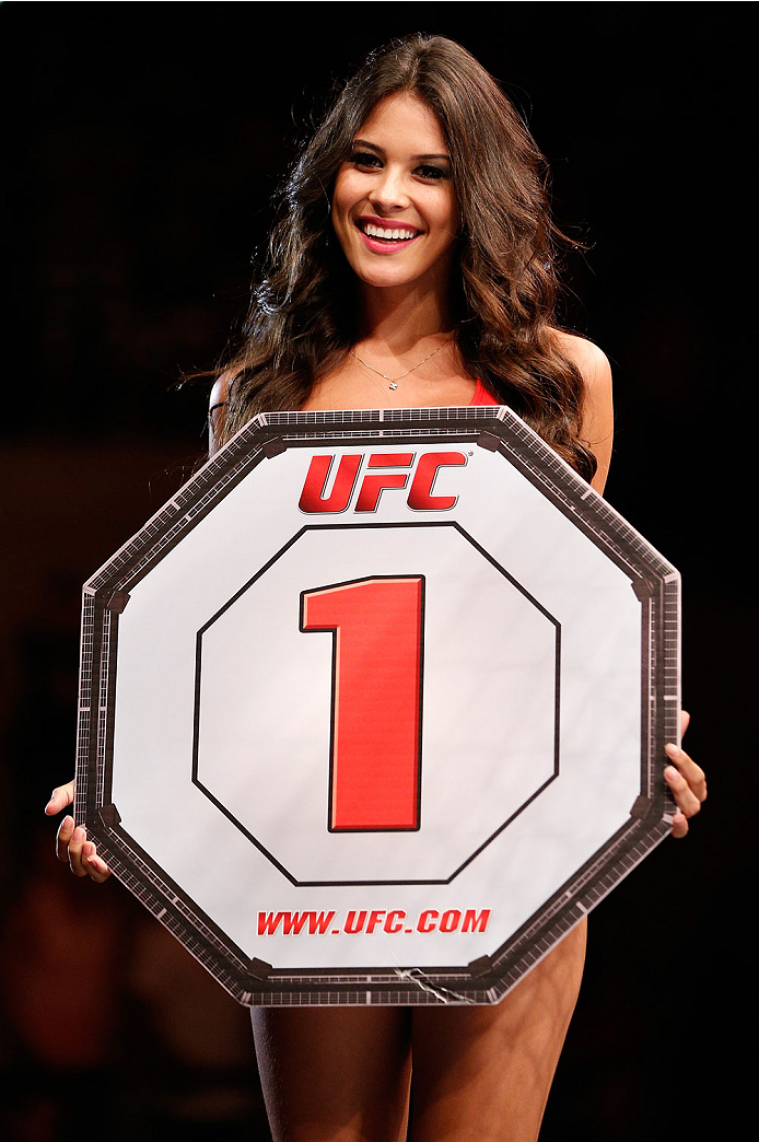 NATAL, BRAZIL - MARCH 23: UFC Octagon Girl Camila Rodrigues de Oliveira introduces a round during the UFC Fight Night event at Ginasio Nelio Dias on March 23, 2014 in Natal, Brazil. (Photo by Josh Hedges/Zuffa LLC/Zuffa LLC via Getty Images)