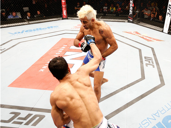 NATAL, BRAZIL - MARCH 23: (L-R) Noad Lahat punches Godofredo "Pepey" Castro in their featherweight bout during the UFC Fight Night event at Ginasio Nelio Dias on March 23, 2014 in Natal, Brazil. (Photo by Josh Hedges/Zuffa LLC/Zuffa LLC via Getty Images)
