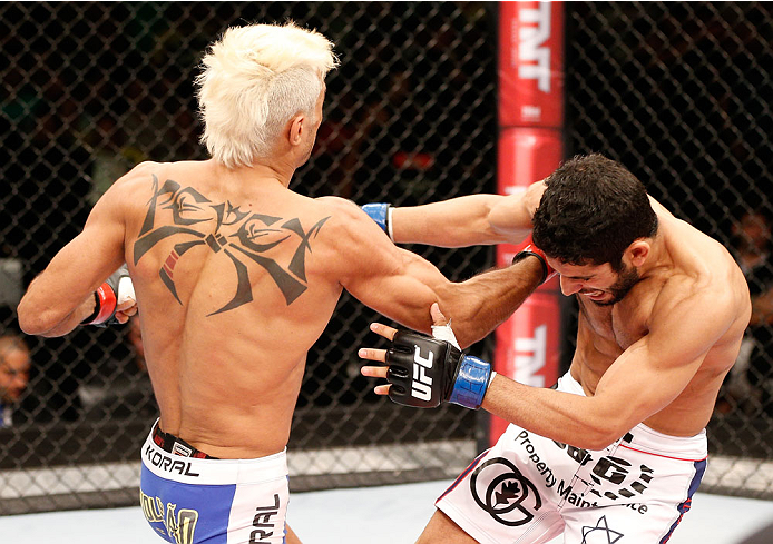 NATAL, BRAZIL - MARCH 23: (L-R) Godofredo "Pepey" Castro punches Noad Lahat in their featherweight bout during the UFC Fight Night event at Ginasio Nelio Dias on March 23, 2014 in Natal, Brazil. (Photo by Josh Hedges/Zuffa LLC/Zuffa LLC via Getty Images)