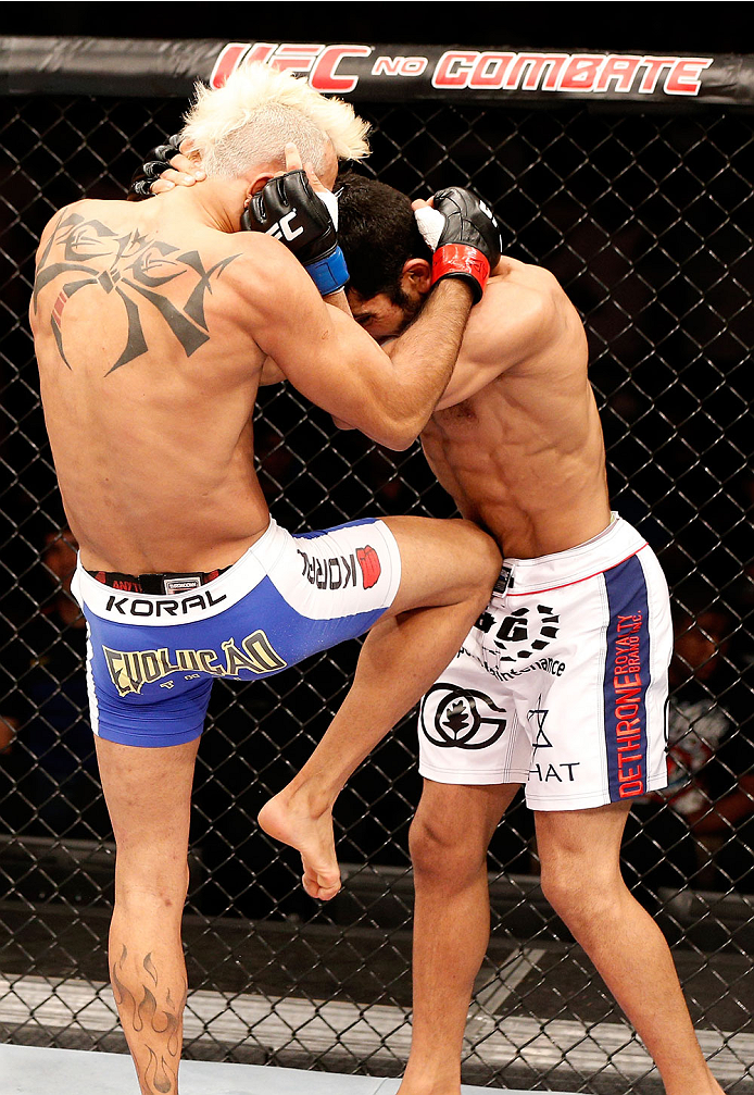NATAL, BRAZIL - MARCH 23: (L-R) Godofredo "Pepey" Castro knees Noad Lahat in their featherweight bout during the UFC Fight Night event at Ginasio Nelio Dias on March 23, 2014 in Natal, Brazil. (Photo by Josh Hedges/Zuffa LLC/Zuffa LLC via Getty Images)
