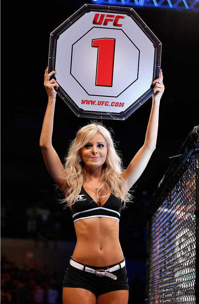NATAL, BRAZIL - MARCH 23: UFC Octagon Girl Jhenny Andrade introduces a round during the UFC Fight Night event at Ginasio Nelio Dias on March 23, 2014 in Natal, Brazil. (Photo by Josh Hedges/Zuffa LLC/Zuffa LLC via Getty Images)