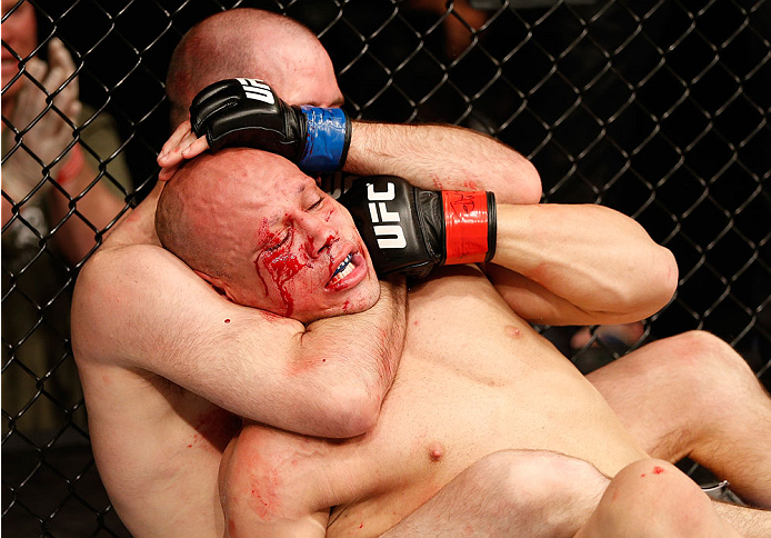 NATAL, BRAZIL - MARCH 23: (L-R) Kenny Robertson secures a rear choke submission against Thiago Perpetuo in their welterweight bout during the UFC Fight Night event at Ginasio Nelio Dias on March 23, 2014 in Natal, Brazil. (Photo by Josh Hedges/Zuffa LLC/