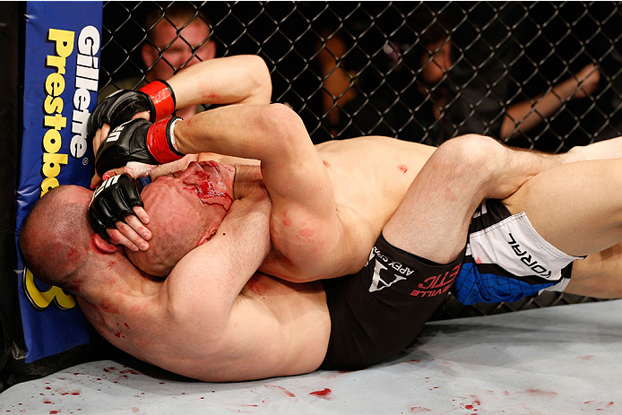 NATAL, BRAZIL - MARCH 23: (L-R) Kenny Robertson secures a rear choke submission against Thiago Perpetuo in their welterweight bout during the UFC Fight Night event at Ginasio Nelio Dias on March 23, 2014 in Natal, Brazil. (Photo by Josh Hedges/Zuffa LLC/