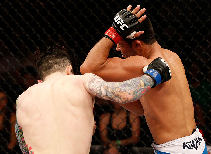 NATAL, BRAZIL - MARCH 23: (R-L) Jussier Formiga elbows Scott Jorgensen in their flyweight bout during the UFC Fight Night event at Ginasio Nelio Dias on March 23, 2014 in Natal, Brazil. (Photo by Josh Hedges/Zuffa LLC/Zuffa LLC via Getty Images)