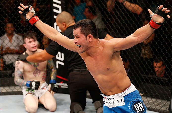 NATAL, BRAZIL - MARCH 23: Jussier Formiga reacts after his submission victory over Scott Jorgensen in their flyweight bout during the UFC Fight Night event at Ginasio Nelio Dias on March 23, 2014 in Natal, Brazil. (Photo by Josh Hedges/Zuffa LLC/Zuffa LL