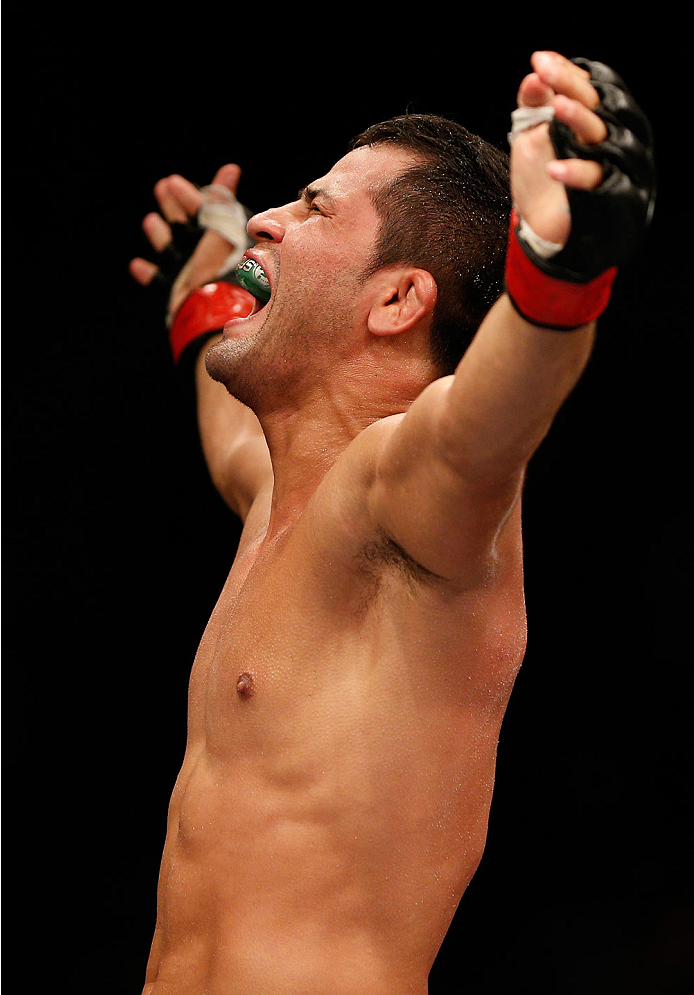 NATAL, BRAZIL - MARCH 23: Jussier Formiga reacts after his submission victory over Scott Jorgensen in their flyweight bout during the UFC Fight Night event at Ginasio Nelio Dias on March 23, 2014 in Natal, Brazil. (Photo by Josh Hedges/Zuffa LLC/Zuffa LL