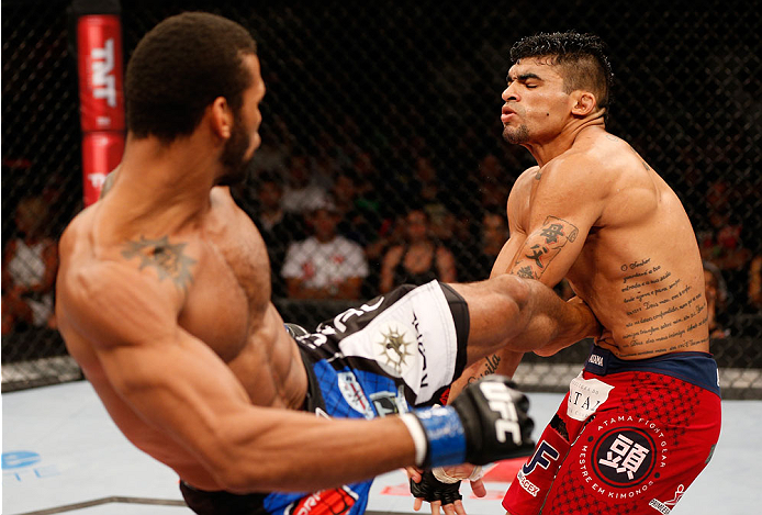 NATAL, BRAZIL - MARCH 23: (L-R) Thiago Santos kicks Ronny Markes in their middleweight bout during the UFC Fight Night event at Ginasio Nelio Dias on March 23, 2014 in Natal, Brazil. (Photo by Josh Hedges/Zuffa LLC/Zuffa LLC via Getty Images)