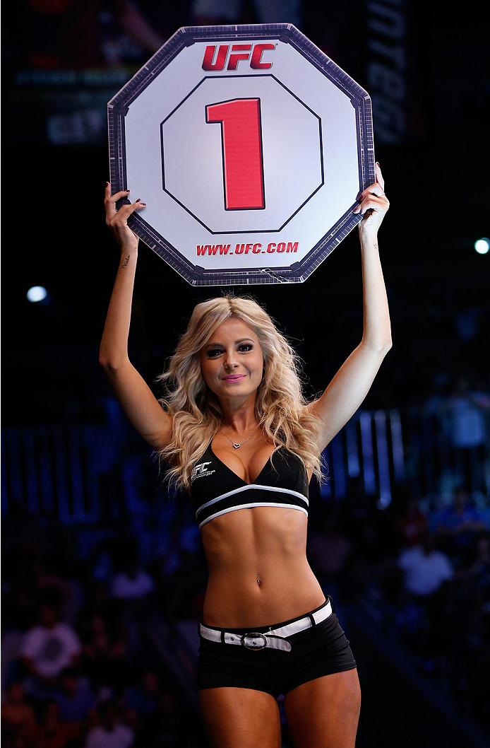 NATAL, BRAZIL - MARCH 23: UFC Octagon Girl Jhenny Andrade introduces a round during the UFC Fight Night event at Ginasio Nelio Dias on March 23, 2014 in Natal, Brazil. (Photo by Josh Hedges/Zuffa LLC/Zuffa LLC via Getty Images)