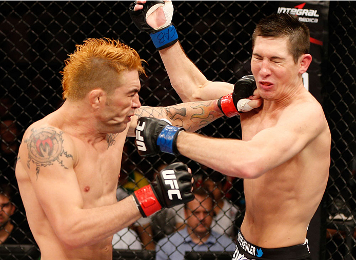 NATAL, BRAZIL - MARCH 23: (L-R) Rony "Jason" Mariano-Bazzera and Steven Siler trade punches in their featherweight bout during the UFC Fight Night event at Ginasio Nelio Dias on March 23, 2014 in Natal, Brazil. (Photo by Josh Hedges/Zuffa LLC/Zuffa LLC v