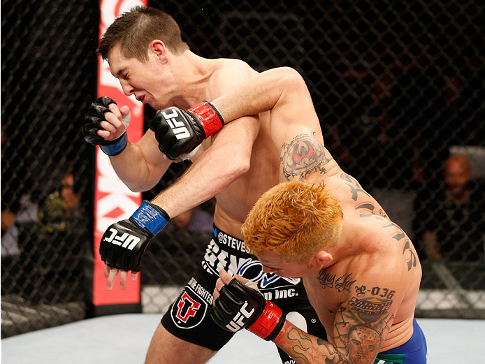 NATAL, BRAZIL - MARCH 23: (R-L) Rony "Jason" Mariano-Bazzera punches Steven Siler in their featherweight bout during the UFC Fight Night event at Ginasio Nelio Dias on March 23, 2014 in Natal, Brazil. (Photo by Josh Hedges/Zuffa LLC/Zuffa LLC via Getty I
