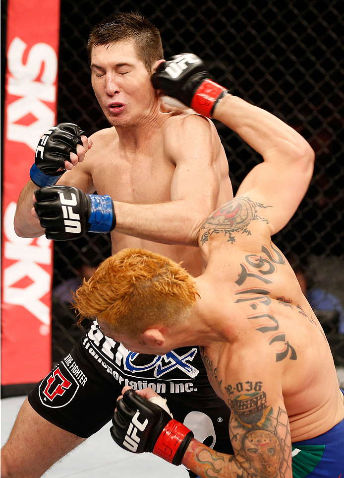 NATAL, BRAZIL - MARCH 23: (R-L) Rony "Jason" Mariano-Bazzera punches Steven Siler in their featherweight bout during the UFC Fight Night event at Ginasio Nelio Dias on March 23, 2014 in Natal, Brazil. (Photo by Josh Hedges/Zuffa LLC/Zuffa LLC via Getty I