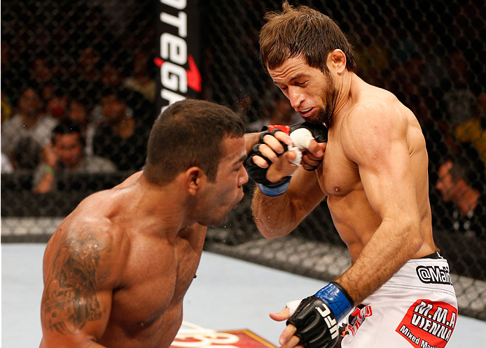 NATAL, BRAZIL - MARCH 23: (L-R) Michel Prazeres punches Maribek Taisumov in their lightweight bout during the UFC Fight Night event at Ginasio Nelio Dias on March 23, 2014 in Natal, Brazil. (Photo by Josh Hedges/Zuffa LLC/Zuffa LLC via Getty Images)