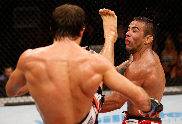 NATAL, BRAZIL - MARCH 23: (L-R) Maribek Taisumov kicks Michel Prazeres in their lightweight bout during the UFC Fight Night event at Ginasio Nelio Dias on March 23, 2014 in Natal, Brazil. (Photo by Josh Hedges/Zuffa LLC/Zuffa LLC via Getty Images)