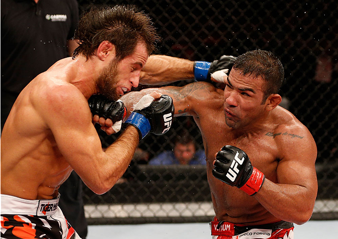 NATAL, BRAZIL - MARCH 23: (R-L) Michel Prazeres punches Maribek Taisumov in their lightweight bout during the UFC Fight Night event at Ginasio Nelio Dias on March 23, 2014 in Natal, Brazil. (Photo by Josh Hedges/Zuffa LLC/Zuffa LLC via Getty Images)