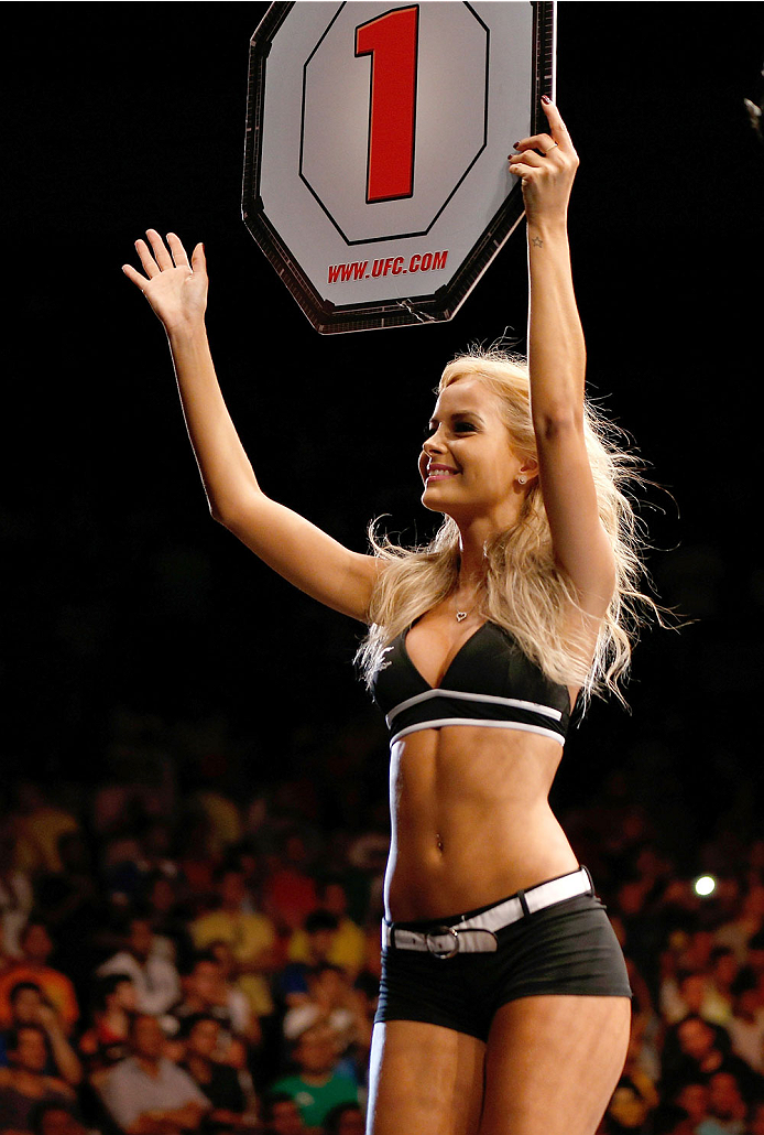 NATAL, BRAZIL - MARCH 23: UFC Octagon Girl Jhenny Andrade introduces a round during the UFC Fight Night event at Ginasio Nelio Dias on March 23, 2014 in Natal, Brazil. (Photo by Josh Hedges/Zuffa LLC/Zuffa LLC via Getty Images)