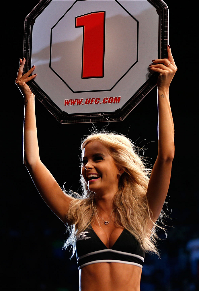 NATAL, BRAZIL - MARCH 23: UFC Octagon Girl Jhenny Andrade introduces a round during the UFC Fight Night event at Ginasio Nelio Dias on March 23, 2014 in Natal, Brazil. (Photo by Josh Hedges/Zuffa LLC/Zuffa LLC via Getty Images)