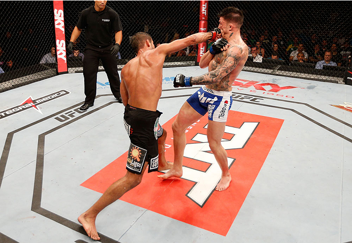 NATAL, BRAZIL - MARCH 23: (L-R) Leonardo Santos punches Norman Parke in their lightweight bout during the UFC Fight Night event at Ginasio Nelio Dias on March 23, 2014 in Natal, Brazil. (Photo by Josh Hedges/Zuffa LLC/Zuffa LLC via Getty Images)