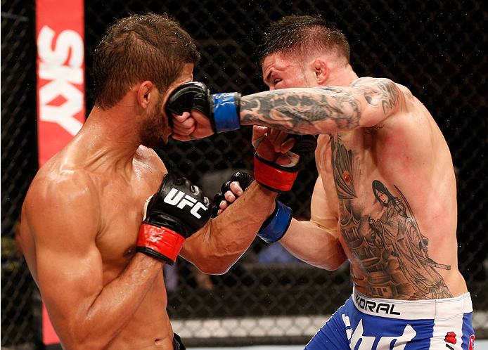 NATAL, BRAZIL - MARCH 23: (R-L) Norman Parke punches Leonardo Santos in their lightweight bout during the UFC Fight Night event at Ginasio Nelio Dias on March 23, 2014 in Natal, Brazil. (Photo by Josh Hedges/Zuffa LLC/Zuffa LLC via Getty Images)