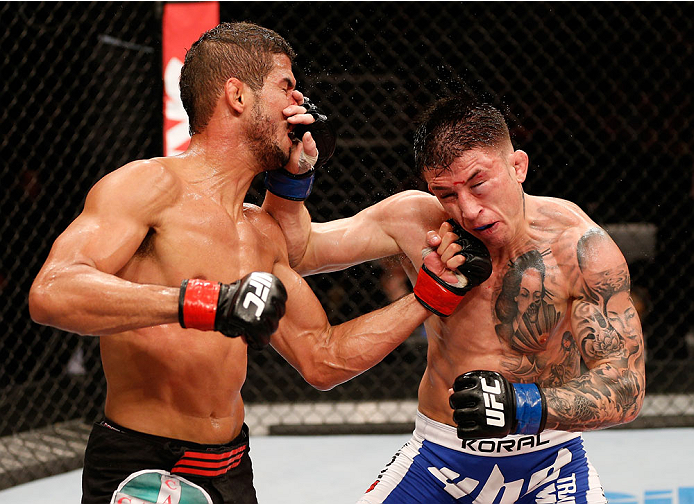 NATAL, BRAZIL - MARCH 23: (L-R) Leonardo Santos punches Norman Parke in their lightweight bout during the UFC Fight Night event at Ginasio Nelio Dias on March 23, 2014 in Natal, Brazil. (Photo by Josh Hedges/Zuffa LLC/Zuffa LLC via Getty Images)