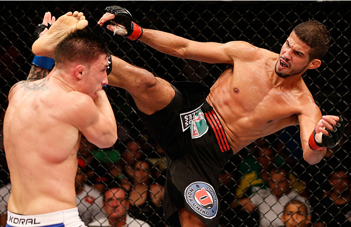 NATAL, BRAZIL - MARCH 23: (R-L) Leonardo Santos kicks Norman Parke in their lightweight bout during the UFC Fight Night event at Ginasio Nelio Dias on March 23, 2014 in Natal, Brazil. (Photo by Josh Hedges/Zuffa LLC/Zuffa LLC via Getty Images)