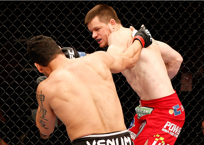 NATAL, BRAZIL - MARCH 23: (R-L) CB Dollaway punches Cezar "Mutante" Ferreira in their middleweight bout during the UFC Fight Night event at Ginasio Nelio Dias on March 23, 2014 in Natal, Brazil. (Photo by Josh Hedges/Zuffa LLC/Zuffa LLC via Getty Images)