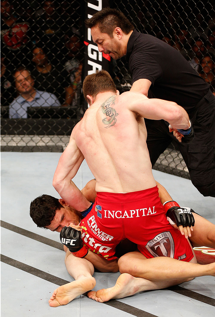 NATAL, BRAZIL - MARCH 23: (R-L) CB Dollaway punches Cezar "Mutante" Ferreira in their middleweight bout during the UFC Fight Night event at Ginasio Nelio Dias on March 23, 2014 in Natal, Brazil. (Photo by Josh Hedges/Zuffa LLC/Zuffa LLC via Getty Images)