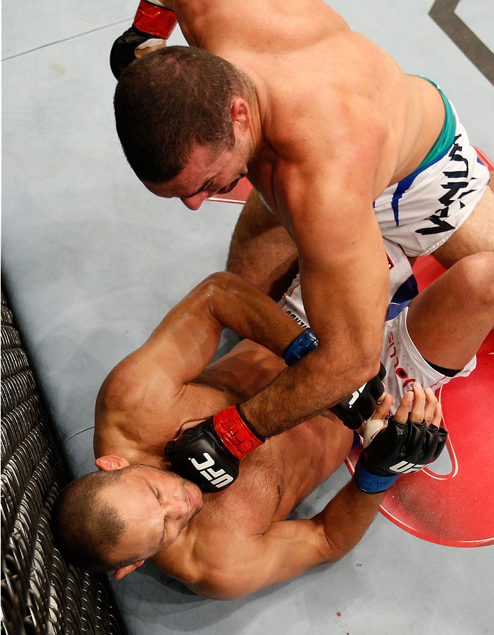 NATAL, BRAZIL - MARCH 23: (R-L) Mauricio "Shogun" Rua punches Dan Henderson in their light heavyweight bout during the UFC Fight Night event at Ginasio Nelio Dias on March 23, 2014 in Natal, Brazil. (Photo by Josh Hedges/Zuffa LLC/Zuffa LLC via Getty Ima
