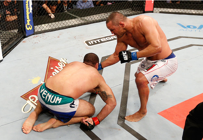 NATAL, BRAZIL - MARCH 23: Dan Henderson punches Mauricio "Shogun" Rua in their light heavyweight bout during the UFC Fight Night event at Ginasio Nelio Dias on March 23, 2014 in Natal, Brazil. (Photo by Josh Hedges/Zuffa LLC/Zuffa LLC via Getty Images)