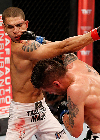 JARAGUA DO SUL, BRAZIL - MAY 18: (R-L) Jeremy Larsen punches Lucas Martins in their lightweight bout during the UFC on FX event on May 18, 2013 at Arena Jaragua in Jaragua do Sul, Santa Catarina, Brazil. (Photo by Josh Hedges/Zuffa LLC/Zuffa LLC via Getty
