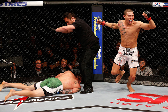JARAGUA DO SUL, BRAZIL - MAY 18: (R-L) Lucas Martins reacts after knocking out Jeremy Larsen in their lightweight bout during the UFC on FX event on May 18, 2013 at Arena Jaragua in Jaragua do Sul, Santa Catarina, Brazil. (Photo by Josh Hedges/Zuffa LLC/Z