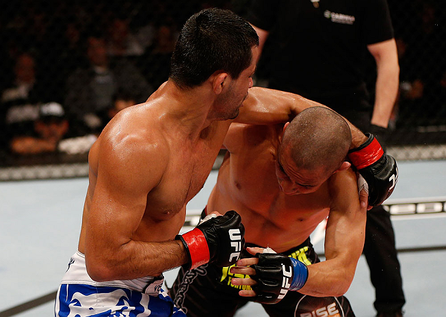 JARAGUA DO SUL, BRAZIL - MAY 18: (L-R) Jussier Formiga punches Chris Cariaso in their flyweight bout during the UFC on FX event on May 18, 2013 at Arena Jaragua in Jaragua do Sul, Santa Catarina, Brazil. (Photo by Josh Hedges/Zuffa LLC/Zuffa LLC via Ge