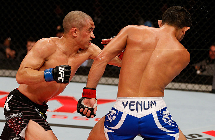 JARAGUA DO SUL, BRAZIL - MAY 18: (L-R) Chris Cariaso punches Jussier Formiga in their flyweight bout during the UFC on FX event on May 18, 2013 at Arena Jaragua in Jaragua do Sul, Santa Catarina, Brazil. (Photo by Josh Hedges/Zuffa LLC/Zuffa LLC via Ge