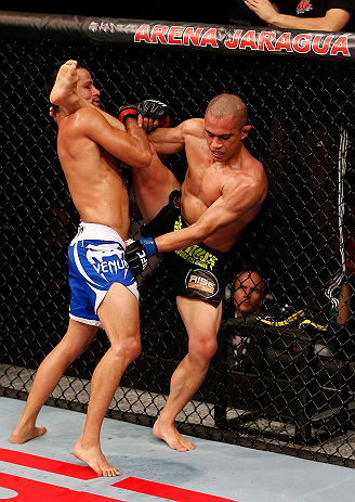 JARAGUA DO SUL, BRAZIL - MAY 18: (L-R) Jussier Formiga attempts to take down Chris Cariaso in their flyweight bout during the UFC on FX event on May 18, 2013 at Arena Jaragua in Jaragua do Sul, Santa Catarina, Brazil. (Photo by Josh Hedges/Zuffa LLC/Zu