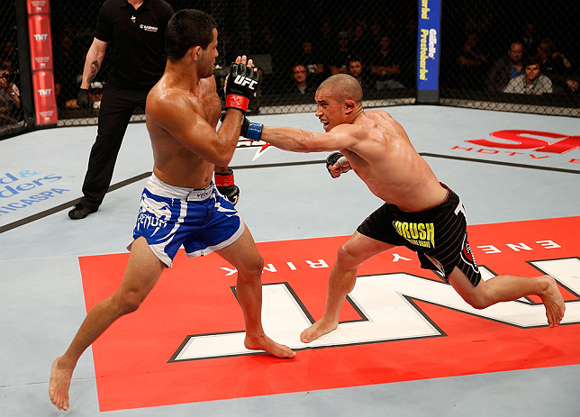 JARAGUA DO SUL, BRAZIL - MAY 18: (R-L) Chris Cariaso punches Jussier Formiga in their flyweight bout during the UFC on FX event on May 18, 2013 at Arena Jaragua in Jaragua do Sul, Santa Catarina, Brazil. (Photo by Josh Hedges/Zuffa LLC/Zuffa LLC via Ge