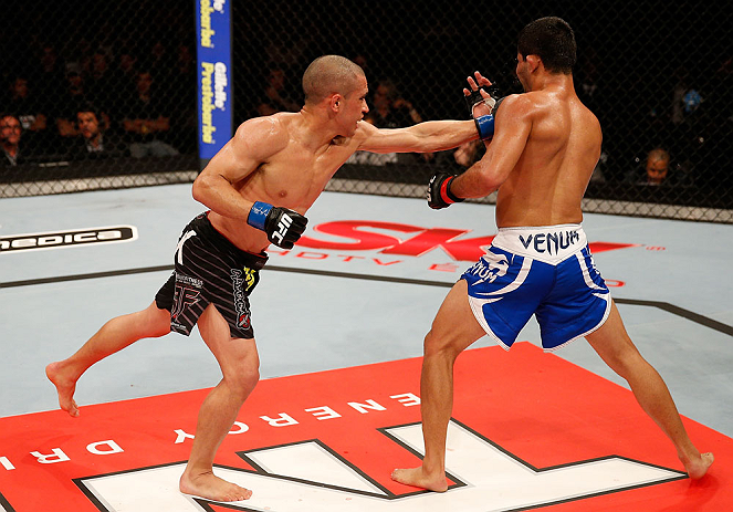 JARAGUA DO SUL, BRAZIL - MAY 18: (L-R) Chris Cariaso punches Jussier Formiga in their flyweight bout during the UFC on FX event on May 18, 2013 at Arena Jaragua in Jaragua do Sul, Santa Catarina, Brazil. (Photo by Josh Hedges/Zuffa LLC/Zuffa LLC via Ge
