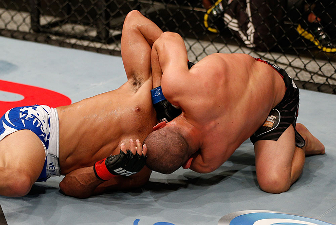JARAGUA DO SUL, BRAZIL - MAY 18: (R-L) Chris Cariaso attempts a guillotine choke submission against Jussier Formiga in their flyweight bout during the UFC on FX event on May 18, 2013 at Arena Jaragua in Jaragua do Sul, Santa Catarina, Brazil. (Photo by