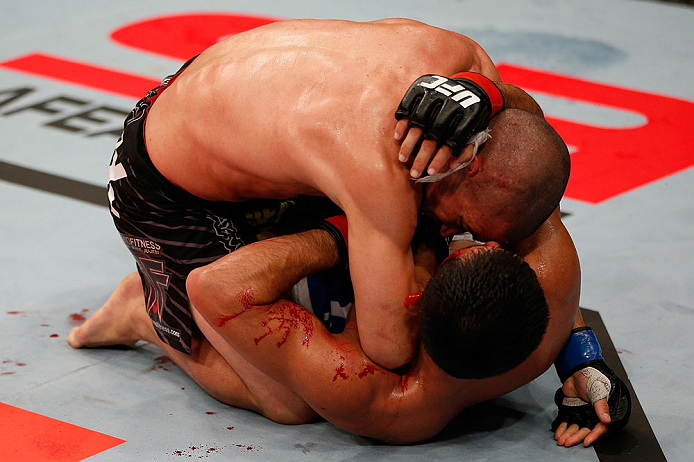 JARAGUA DO SUL, BRAZIL - MAY 18: (L-R) Chris Cariaso elbows Jussier Formiga in their flyweight bout during the UFC on FX event on May 18, 2013 at Arena Jaragua in Jaragua do Sul, Santa Catarina, Brazil. (Photo by Josh Hedges/Zuffa LLC/Zuffa LLC via Get