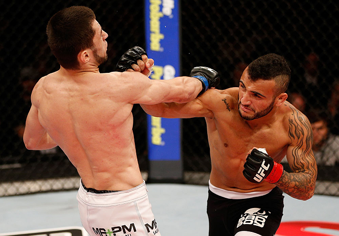 JARAGUA DO SUL, BRAZIL - MAY 18: (R-L) John Lineker punches Azamat Gashimov in their flyweight bout during the UFC on FX event on May 18, 2013 at Arena Jaragua in Jaragua do Sul, Santa Catarina, Brazil. (Photo by Josh Hedges/Zuffa LLC/Zuffa LLC via Get