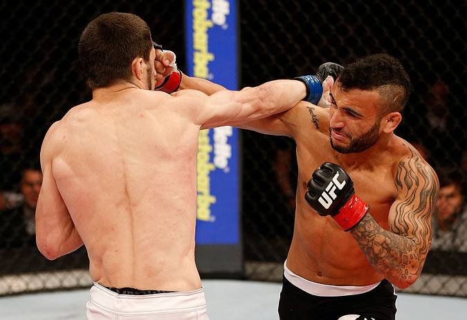 JARAGUA DO SUL, BRAZIL - MAY 18: (R-L) John Lineker punches Azamat Gashimov in their flyweight bout during the UFC on FX event on May 18, 2013 at Arena Jaragua in Jaragua do Sul, Santa Catarina, Brazil. (Photo by Josh Hedges/Zuffa LLC/Zuffa LLC via Get