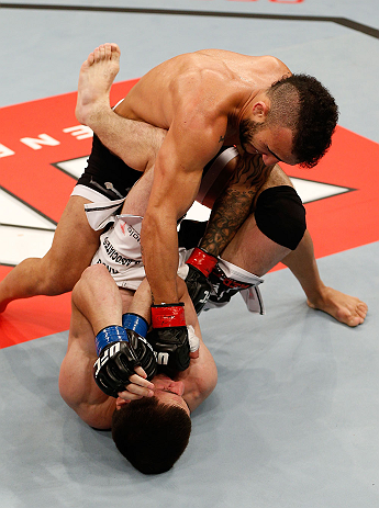 JARAGUA DO SUL, BRAZIL - MAY 18: (R-L) John Lineker punches Azamat Gashimov in their flyweight bout during the UFC on FX event on May 18, 2013 at Arena Jaragua in Jaragua do Sul, Santa Catarina, Brazil. (Photo by Josh Hedges/Zuffa LLC/Zuffa LLC via Get