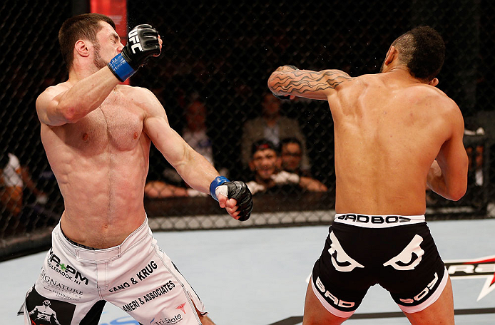 JARAGUA DO SUL, BRAZIL - MAY 18: (R-L) John Lineker punches Azamat Gashimov in their flyweight bout during the UFC on FX event on May 18, 2013 at Arena Jaragua in Jaragua do Sul, Santa Catarina, Brazil. (Photo by Josh Hedges/Zuffa LLC/Zuffa LLC via Get